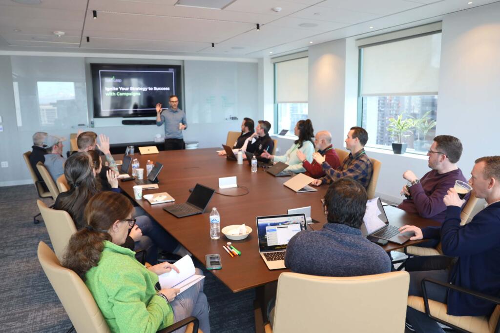 Christian in boardroom presenting